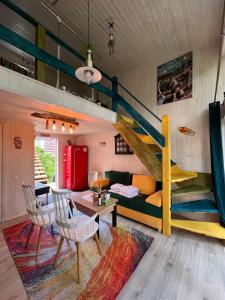 a living room with a loft bed and a couch at Апартаменти Smereka in Yablunytsya +290 photos