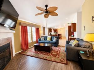 a living room with a couch and a fireplace at Ticaboo Lodge in Ticaboo