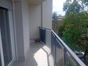 a balcony of a building with a view of a tree at Modena Sound Suite in Modena