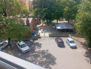 a group of three cars parked in a parking lot at Modena Sound Suite in Modena +11 photos