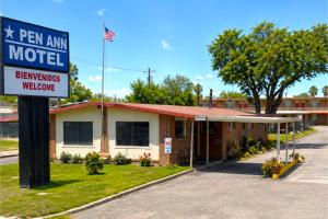 a motel sign in front of a motel at Pen Ann by Capital O Pharr-McAllen TX in Pharr