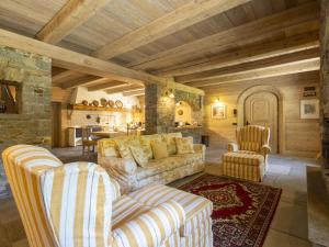 a living room with a couch and two chairs at Chalet Chalet Anna by Interhome in Grosotto +72 photos
