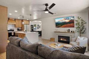 a living room with a couch and a fireplace at Page House in Gilbert
