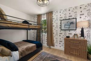 a bedroom with a bunk bed and a desk at Page House in Gilbert