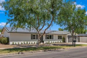 a house with a tree in front of it at Page House in Gilbert