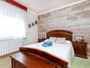 a bedroom with a wooden bed and a wooden desk at Holiday Home Figaro by Interhome in Blanes