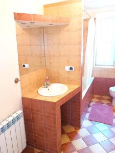 a bathroom with a sink and a toilet at Dom u Tosi pod Zatorem in Spytkowice +18 photos