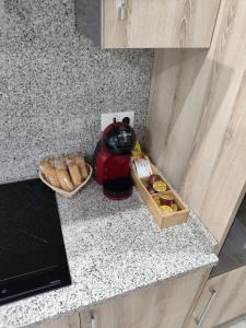 a kitchen counter with a blender and a box of donuts at Luz De Luna in Negreira