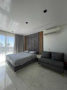 a bedroom with a bed and a couch at Jasmine Resort Complex in Sharm El Sheikh +58 photos