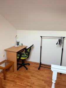 an office with a desk and a table and a chair at Lumier Apartment in Zelenika +1 photo