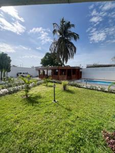 a view of the house from the yard at La Villa Eden in Pointe-Noire