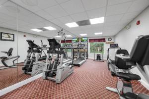 a gym with treadmills and ellipticals in a room at Hawthorn Suites Suite Near Universal & I-Drive in Orlando