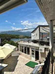 a view from the balcony of a building with a green mat at Apartmani Bjelila in Tivat