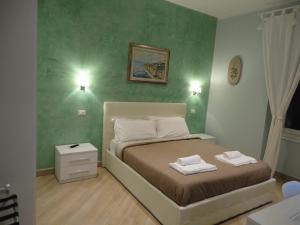Postel nebo postele na pokoji v ubytování Guest House Le Tre Spezie