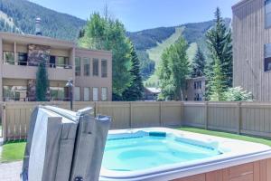 a large plunge pool in a backyard with a house at Bliss at the Base in Ketchum