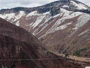 a view of a mountain with snow covered mountains at Borjomi Paradise in Borjomi