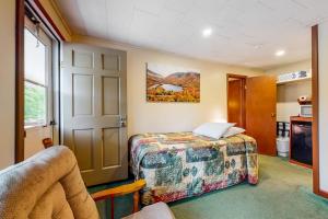 a hotel room with a bed and a door at Riverbank Connecting Rooms 3 & 5 in Lincoln