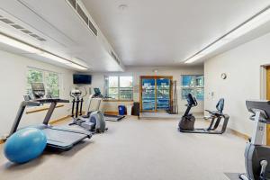 a gym with several treadmills and exercise bikes at River Mountain Lodge #W101 in Breckenridge