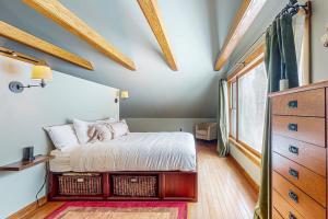 a bedroom with a bed and a dresser and a window at The Loft at Fort Defiance in Barnard
