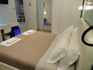 Postel nebo postele na pokoji v ubytování Guest House Le Tre Spezie