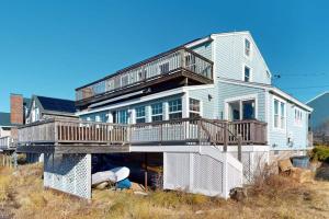a house with a deck on top of it at Fisherman in Newburyport