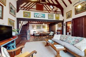 a living room with a couch and a table at Great Ledges Studio in Rockport