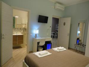 Postel nebo postele na pokoji v ubytování Guest House Le Tre Spezie