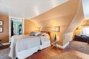 a bedroom with a large bed and a staircase at Longacre of Appomattox in Appomattox +21 photos