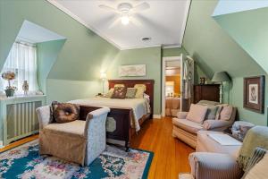 a bedroom with a bed and a living room at Longacre of Appomattox in Appomattox