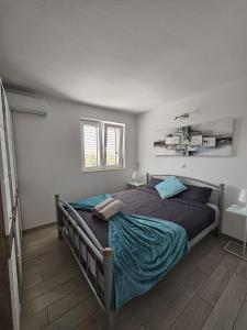 a bedroom with a large bed in a room at Villa Blanka Apartments in Rogoznica +67 photos