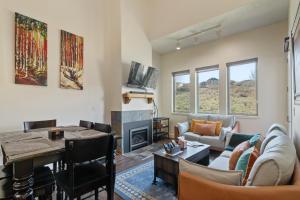 a living room with a couch and a table at Crestview Condominiums by All Seasons Resort Lodging in Park City