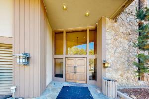 a front door of a house with a stone wall at Million Dollar View- 419 in Durango +52 photos