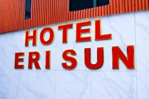 a hotel exit sign on the side of a building at Hotel Erisun in Vlorë