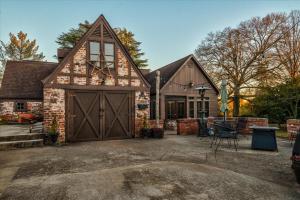 a barn style house with a garage at Longacre of Appomattox in Appomattox