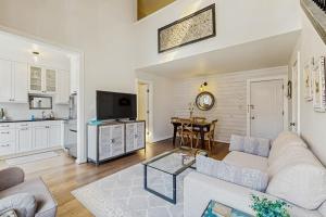 a living room with a couch and a table at Jarvis #301 in Durango