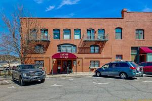 two cars parked in a parking lot in front of a building at Jarvis #301 in Durango