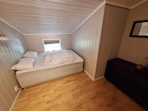a small bedroom with a bed in a room at Aurlandsdalen in Aurland