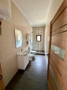 a bathroom with two toilets and a sink at The Selo in Korostovat +49 photos