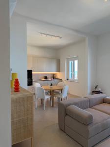 a living room with a couch and a table at Lungomare 83 in Francavilla al Mare