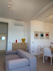 a living room with a couch and a table at Lungomare 83 in Francavilla al Mare