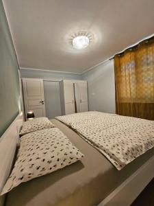 a small bedroom with two beds and a window at Old Village House Brda in Kojsko +15 photos