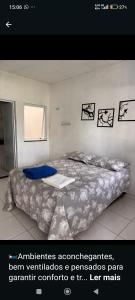 a bedroom with a large bed in a room at Pousada Padre Pio CE in São Benedito +1 photo