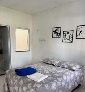a bedroom with a bed and a window at Pousada Padre Pio CE in São Benedito