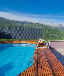 a large swimming pool sitting on top of a building at Apartment Nature Beauty in Zagvozd