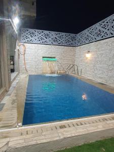 a large swimming pool with a water fountain at la sublime in Taghazout +35 photos