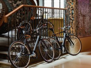 a group of bikes parked next to a rail at 25hours Hotel Dubai One Central in Dubai