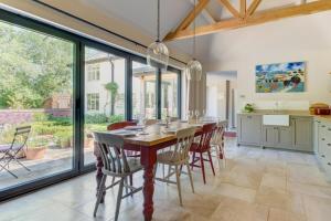 a kitchen and dining room with a table and chairs at 4 Bed in Walpole oc-brof in Walpole