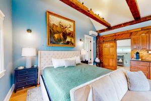 a bedroom with a large bed in a room at The Lodge - Suite #3 in Waterbury
