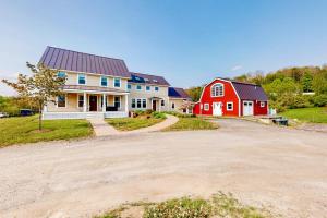 a house with a red and white house at The Lodge - Suite #3 in Waterbury