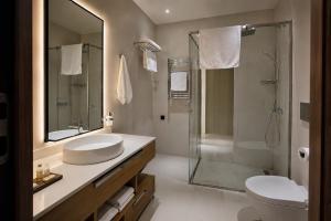 a bathroom with a sink and a shower at White Villas in Nardaran